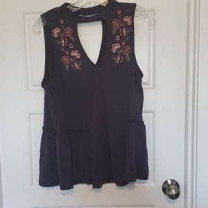 Gently worn chokeneck navy blue peplum shirt